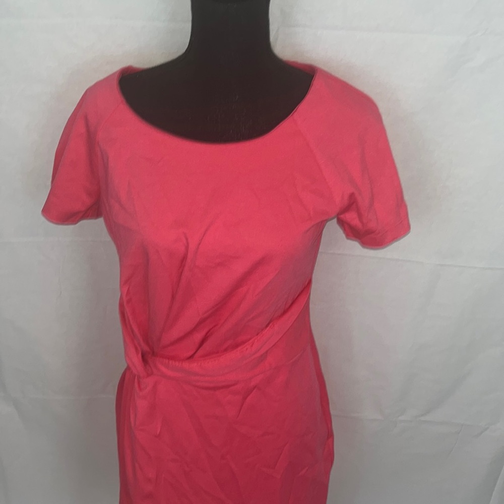 This is a peach dress that is a size medium.